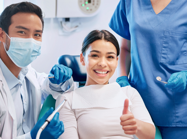 Smiling patient with dentist